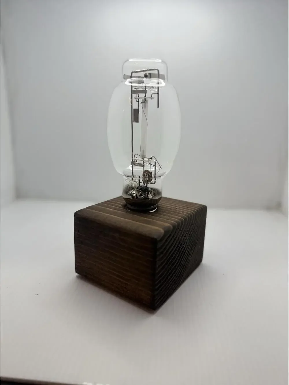 Vintage Retro High Pressure Sodium Industrial Bulb Display on Wood Pedestal